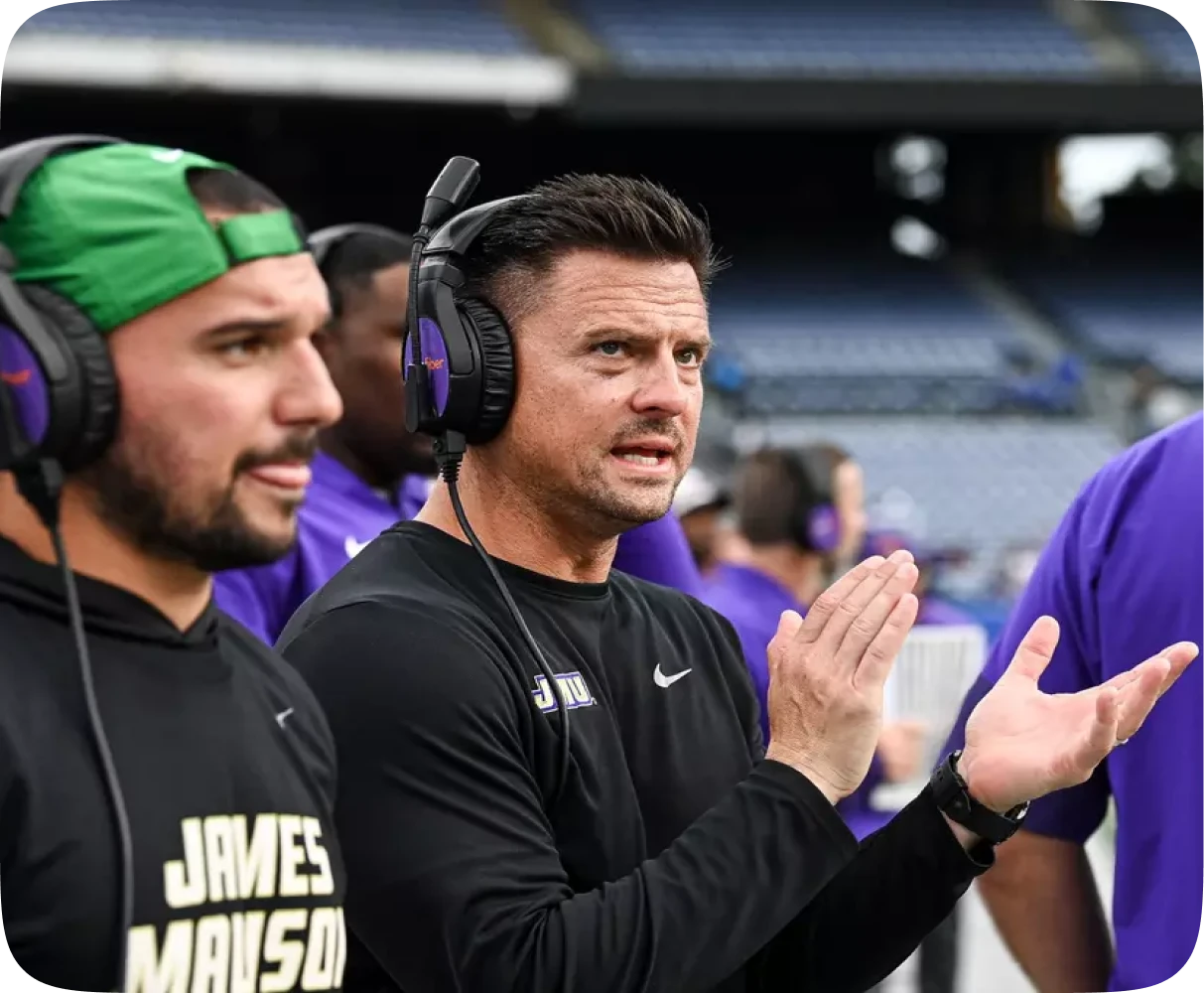 Athletic trainer assistant with the JMU football alumni community at a JMU football game supporting alumni donors