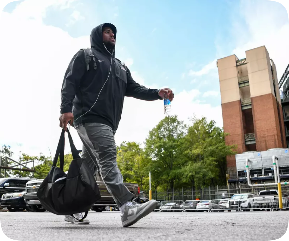 JMU football alumni community building careers through mentorship and networking at a JMU football game