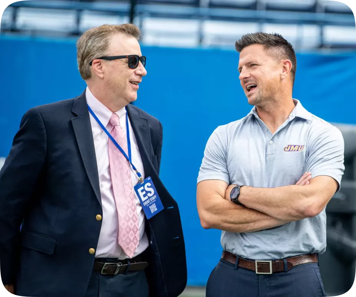 JMU football alumni community building careers through professional networking at a JMU football game