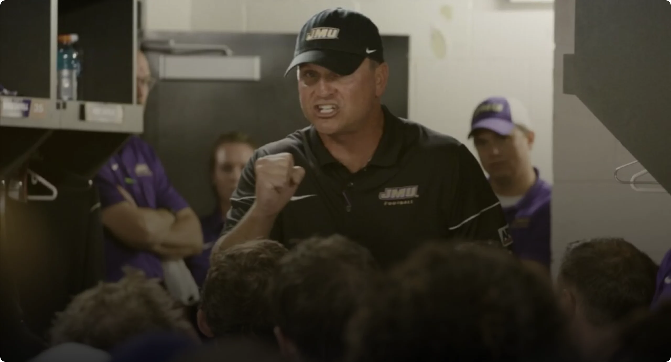 Mike Houston JMU football alumni coach celebrating JMU football history and alumni community