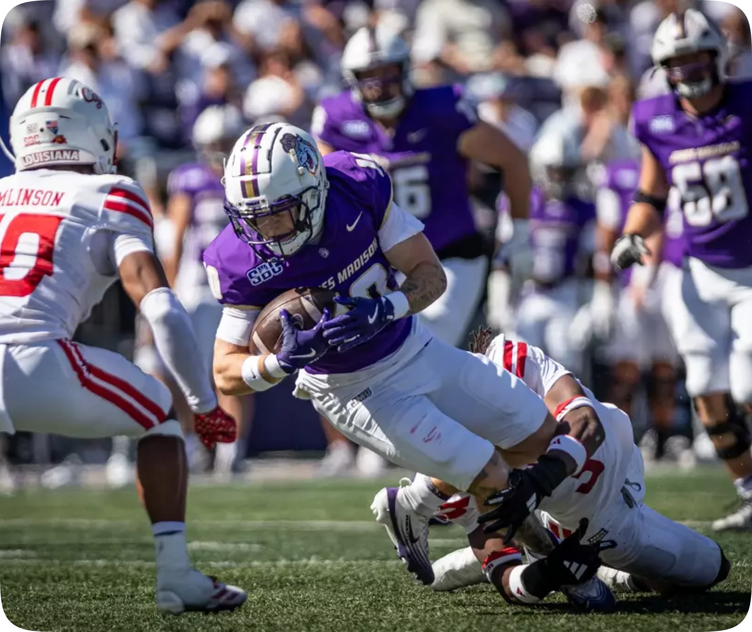 JMU football alumni community mentoring via the Dukes Lead program at a JMU football game